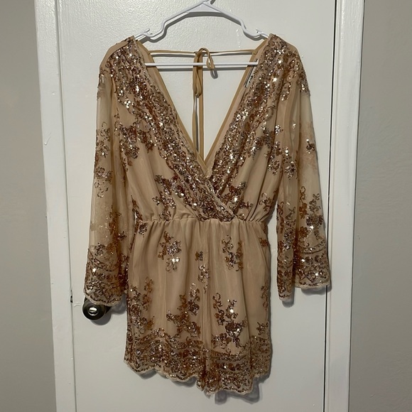 I bought this beautiful romper and never used it. - Picture 1 of 2